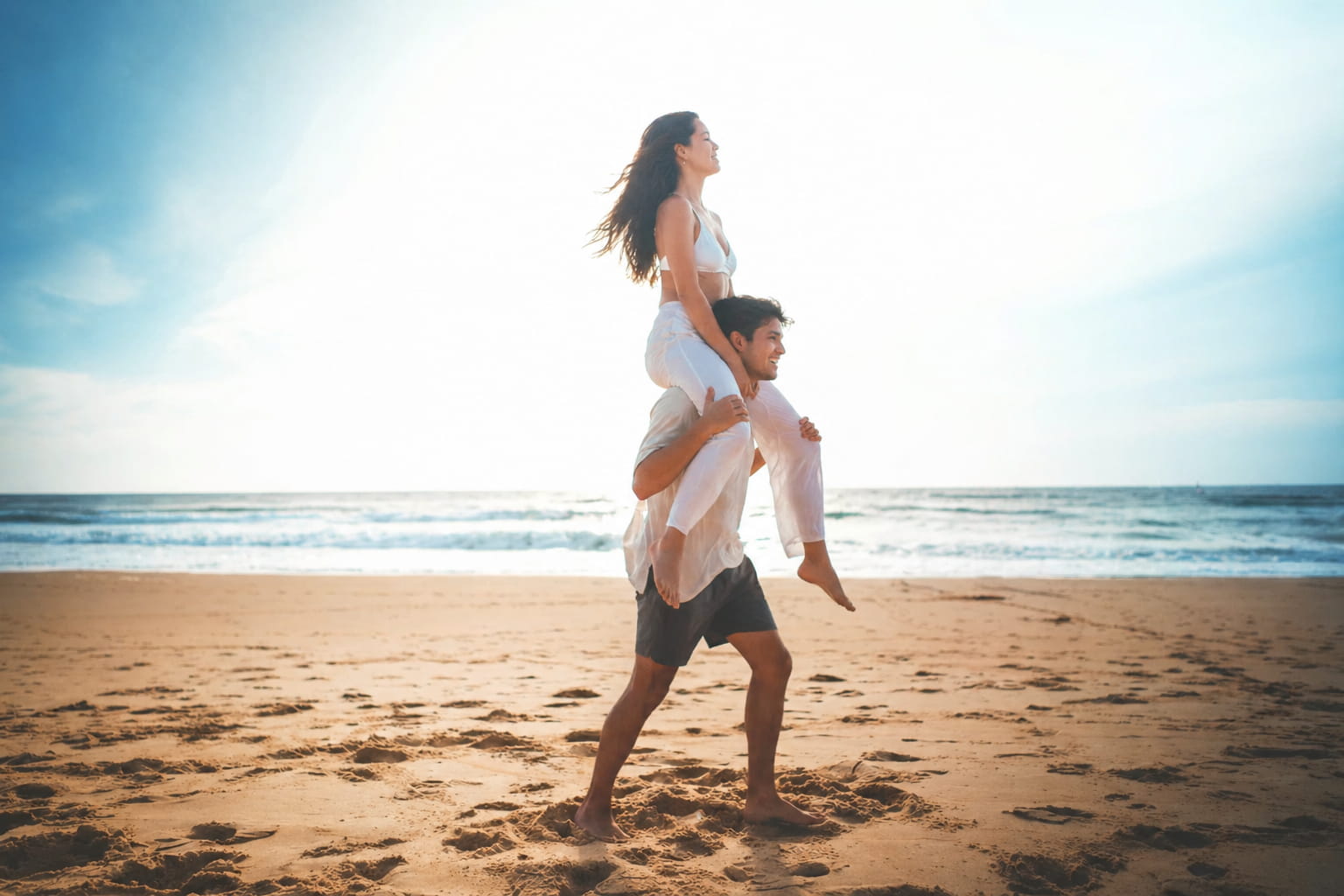 Person giving a piggyback ride on a sunny beach